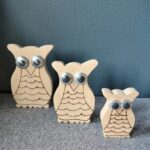 Set van 3 houten uilen